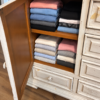 0945107A-4B8F-4E2E-B1AF-A3B0BDC7CCF3 Distressed Ivory King Bed & Architectural Storage Dresser Set